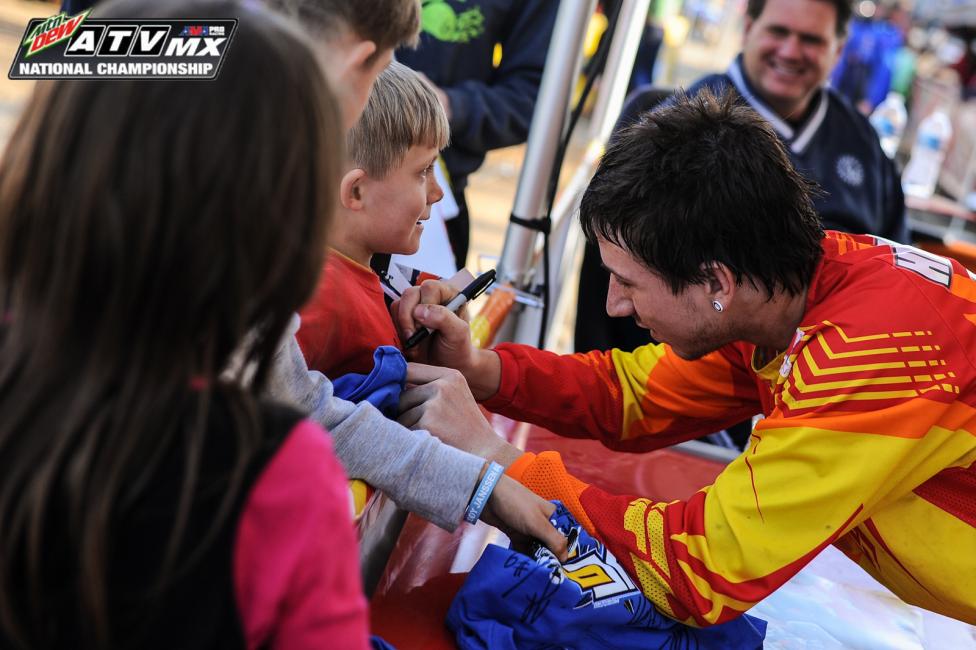 Joel Hetrick signs some of his biggest little fans shirts at round 2