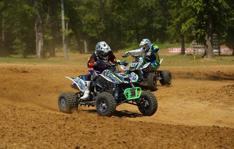 Sam Rowe leads Dalton Hicks through a sweeper turn at round five of the 2014 Mtn. Dew ATVMX National Championship Series held at Briarcliff MX in Ohio. Rowe won the class and Hicks ended up second, giving Root River Racing / ITP a 1-2 finish